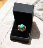 Anillo barroco de turquesa con diamantes en oro de 18k